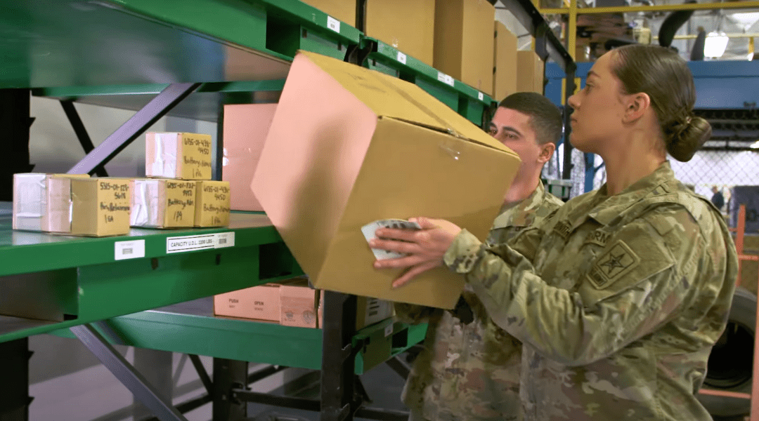 Female Army Officer picking boxes 92A MOS Automated Logistical Specialist