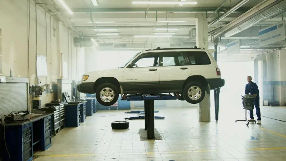 Image representing an auto repair shop, showing mechanics working on cars with various tools.