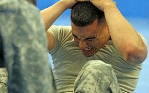 Soldier doing sit-ups apft acft