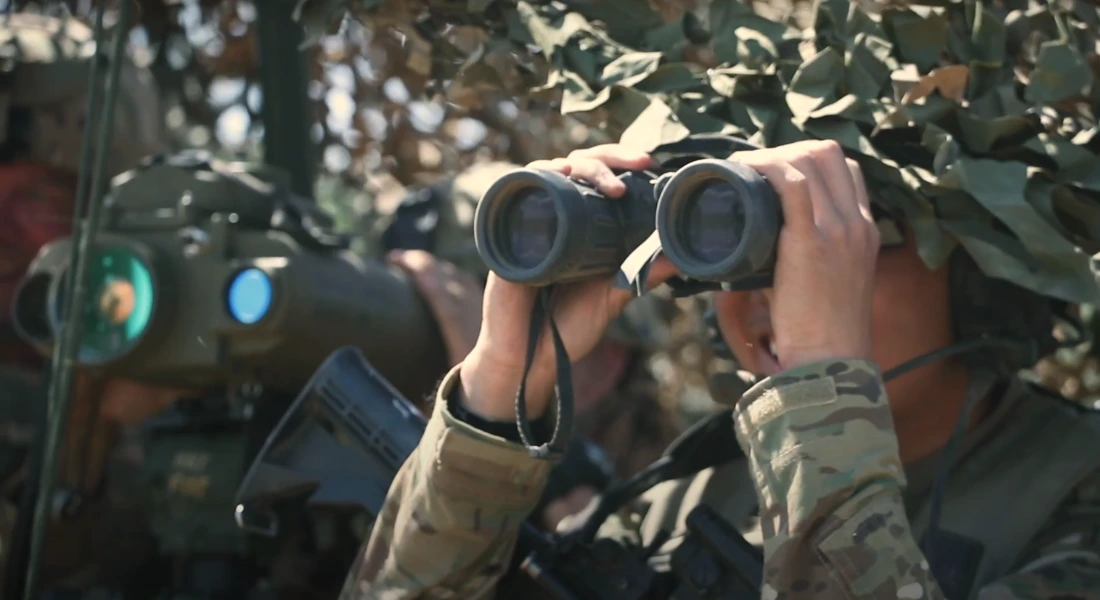 Soldier looking from binocular